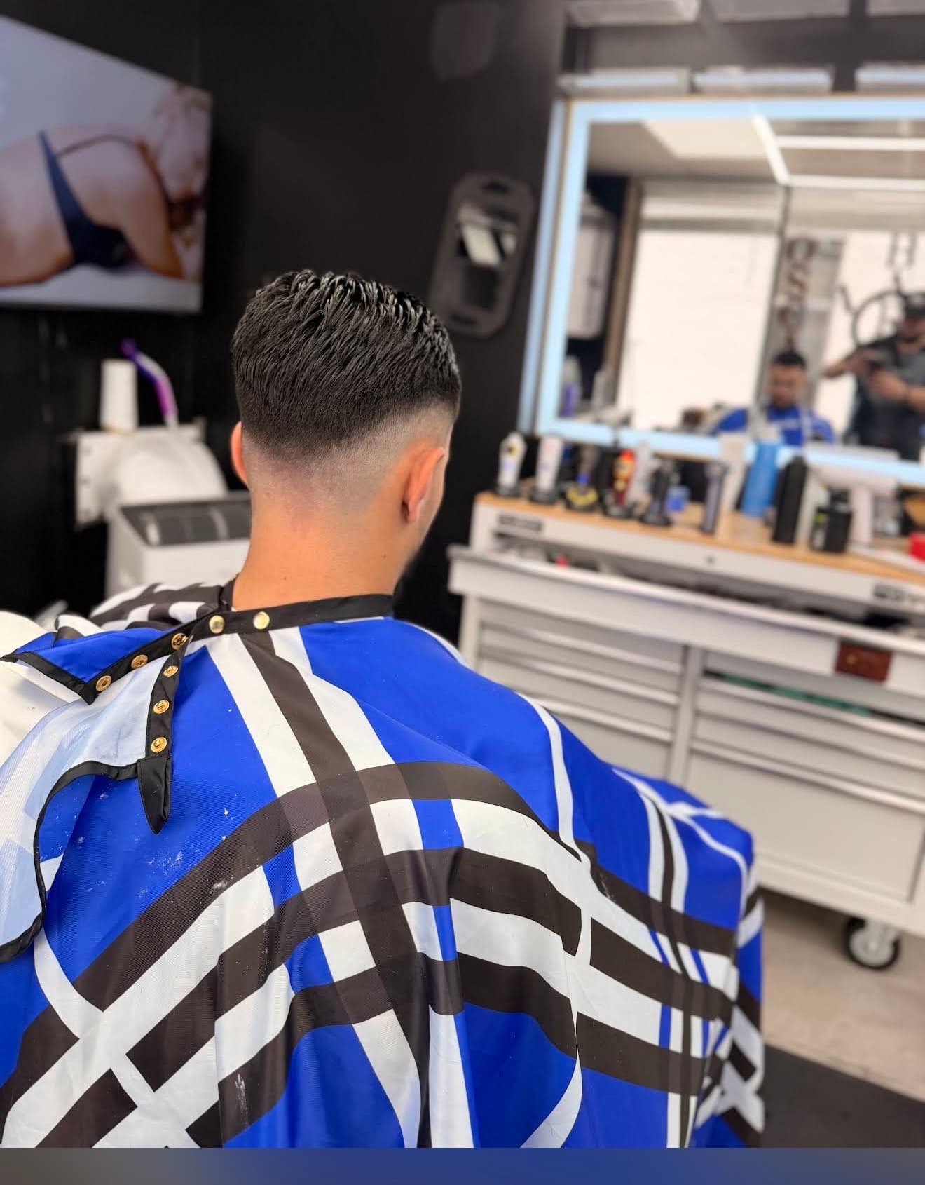 Oscar A. Barber haircut in progress